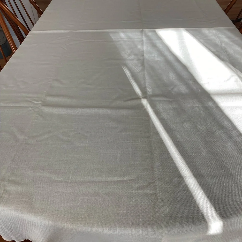 Off white oval tablecloth 96” x 56”